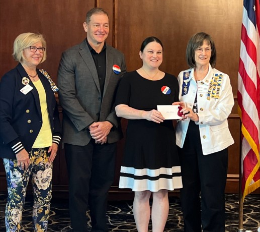 group of people after an award presentation