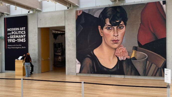 Student entering exhibition at museum.