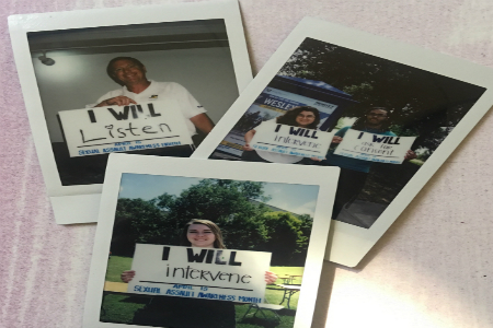 Photo of Texas Wesleyan University students holding up signs for sexual assault awareness month.